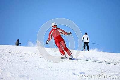 Young female skier on a mountain slope Stock Photo