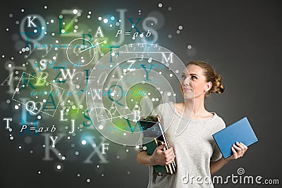 Young female student with clouds of bright formulas, numbers, le Stock Photo