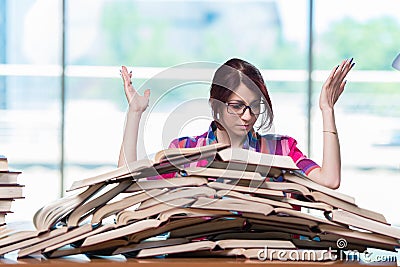 The young female student preparing for exams Stock Photo