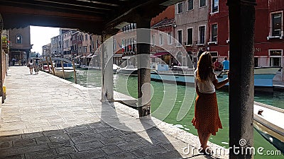 Young female traveler stays in Venice, Italy Editorial Stock Photo