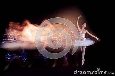 Ballerina dancer on stage with silhouette trail Stock Photo