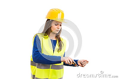 Young female worker using cutter blade Stock Photo