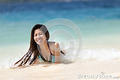 Young Filipina woman swimming Stock Photo