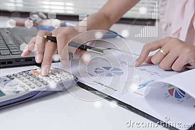 Young finance market analyst working at office on laptop while sitting at white table.Businessman analyze document Stock Photo