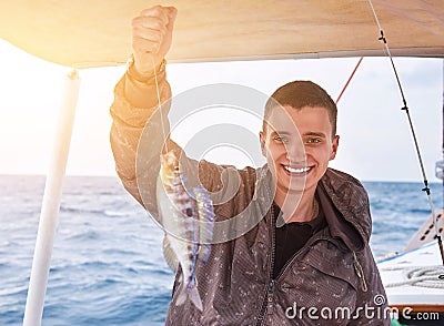 Young fisherman on holidays Stock Photo