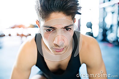 Young fit hispanic man in black sleeveless shirt in gym Stock Photo