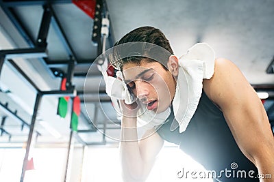 Young fit hispanic man in black sleeveless shirt in gym Stock Photo