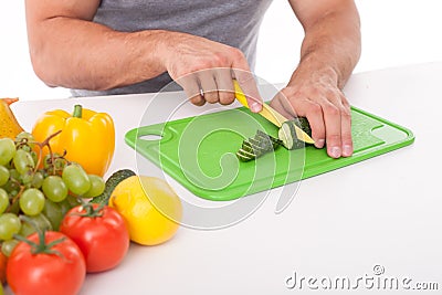 Young fit man is making healthy salad Stock Photo