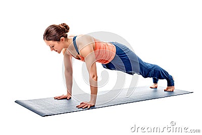 Young fit sporty woman does Hatha yoga plank asana Stock Photo