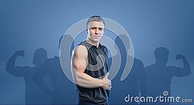 Young fitness man standing sideways and showing thumb up. Stock Photo