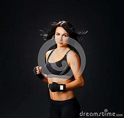 Young fitness woman in gym gloves Stock Photo