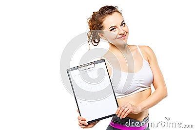 Young fitness woman holding personal workout plan Stock Photo