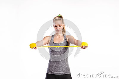 Young fitness woman with rubber bands. Studio shot. Stock Photo