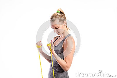 Young fitness woman with rubber bands. Studio shot. Stock Photo
