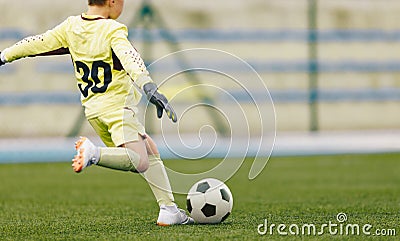 Young Football Goalie Kicking Ball Starting Game Stock Photo