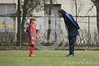 Young football player and his coach Editorial Stock Photo