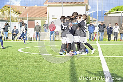 Young football players. Children play a soccer game. Little children cheer for the goal Editorial Stock Photo