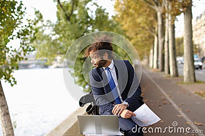 Arabian student preparing before exams near Eiffel Tower with la Stock Photo