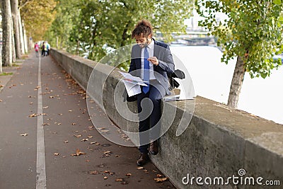 Arabian student preparing before exams near Eiffel Tower with la Stock Photo