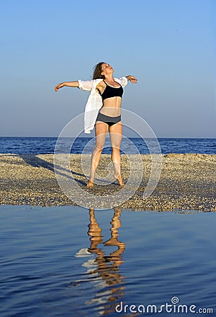 Young free woman at beach Stock Photo