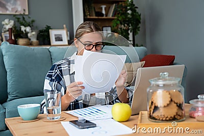Young freelance business woman working at home on laptop as product strategy expert. Female expatriate remote work on internet on Stock Photo