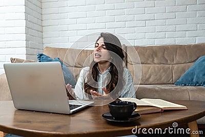 Young freelance graphic designer woman has a problem with attention deficit disorder (ADHD) Stock Photo