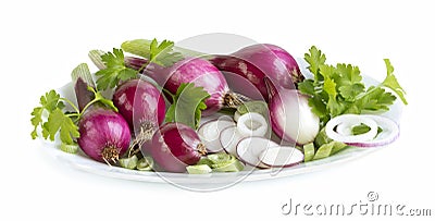 Young fresh onions on a plate, whole and slice, and parsley leaves, isolated on white Stock Photo