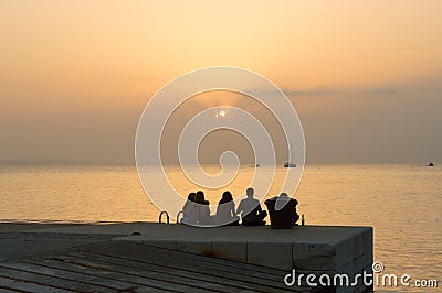 Young friends enjoying amazing sunset Editorial Stock Photo