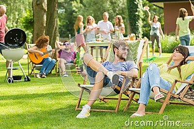 Young friends having barbecue picnic Stock Photo