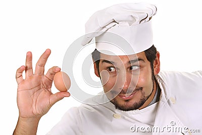 Young funny chef with egg Stock Photo