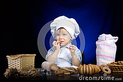 Young funny cook with kitchenware Stock Photo