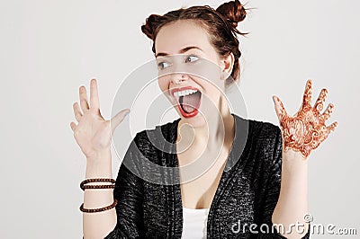 Young funny hipster woman showing tongue, shouting and surprise with funny emotion face. Stock Photo