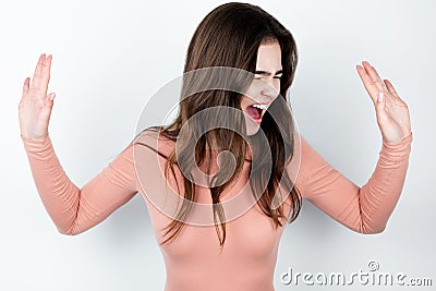 Young furious woman standing on isolated white background looking angry, ,splash of emotions Stock Photo