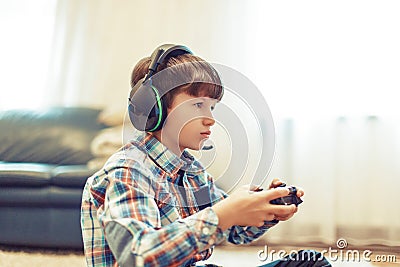 Young gamer kid concentrating while playing Stock Photo