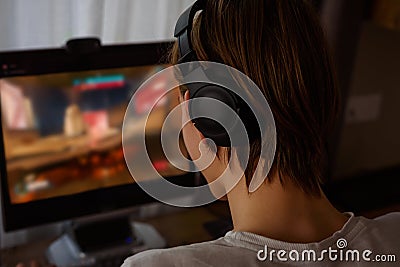 Young gamer playing online video games Stock Photo