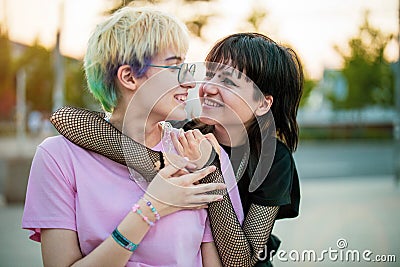 Young gender fluid couple hugging Stock Photo