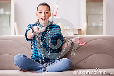 The young girl addicted to tv wasting her time Stock Photo
