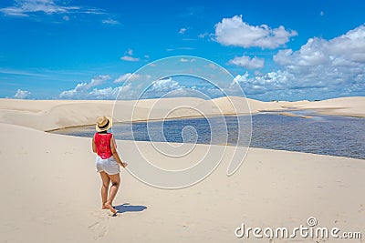 Young girl admiring the beauty of the Lencois Maranhenses, one of the main touristics destinations in Brazil Editorial Stock Photo