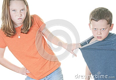 Young girl being mean to boy Stock Photo