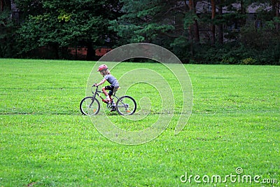 Young girl bike ride Stock Photo