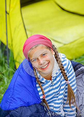 Young girl camping Stock Photo