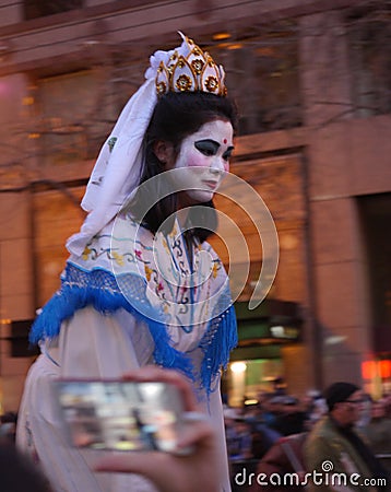 Young girl at the Chinese Parade 2018 San Francisco with white mascara Editorial Stock Photo