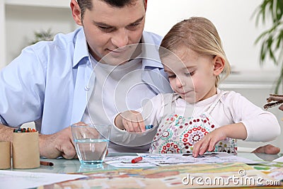 Young girl coloring in Stock Photo