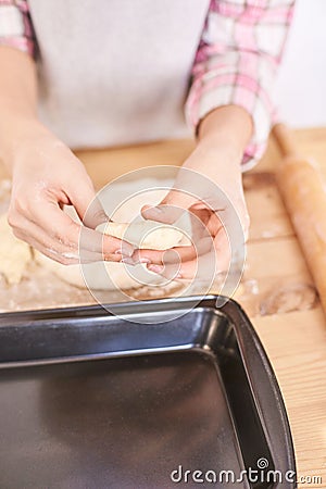 Young girl cooking at kitchen. Curly pretty child portrait. Chef student Stock Photo