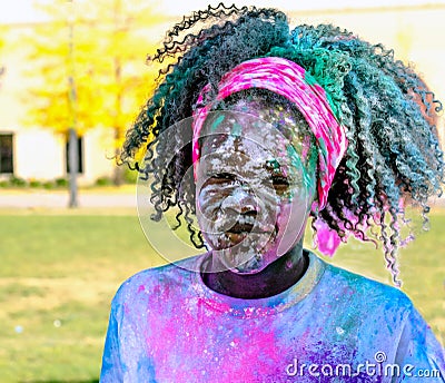 Young girl covered in color at the color run Editorial Stock Photo