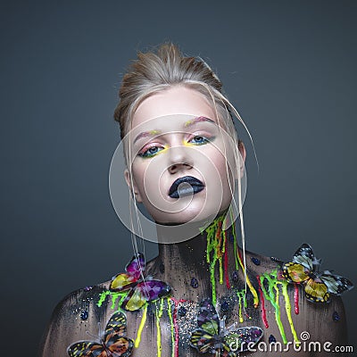 Young girl with creative makeup with butterflies Stock Photo