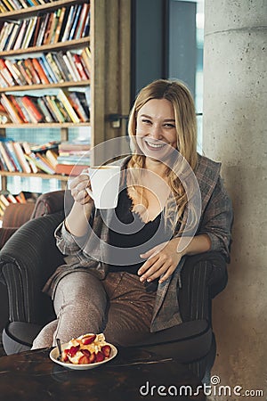 Young girl with a cup of coffee Stock Photo