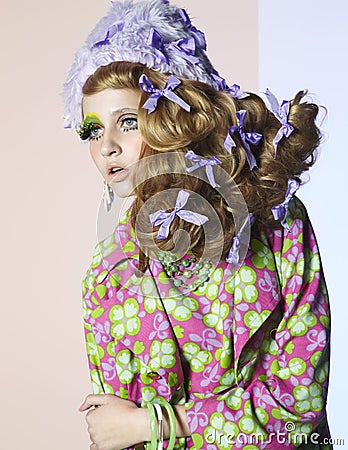 Young girl dancing with developing hair in bright makeup Stock Photo