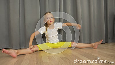 Young Girl Do Split and Stretching at Living Room Indoors. Happy Young Girl Dancing and Sitting. Stock Footage - Video of health, floor: 100792620 
