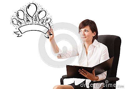 Young girl drawing a party label on whiteboard Stock Photo